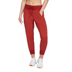 Calia orange joggers. Polyester spandex mix. Cute and comfortable.